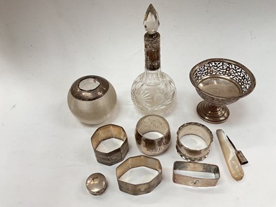 Lot 1160 - Group of silver to include napkin rings, silver mounted vesta globe, perfume bottle, pierced pedestal dish etc