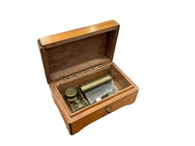 Lot 765 - Small oak cased music box.