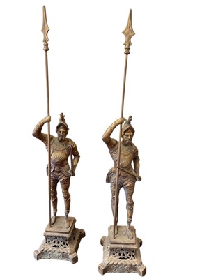 Lot 898 - Pair of large brass fire side figures in the form of knights, each 98.5cm in overall height.