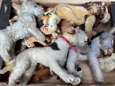 Lot 1812 - Steiff and other mohair and velvet toys including dog Made in US zone Germany, small cat, miniature teddy, clockwork chick, lion etc.