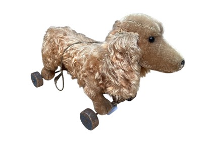 Lot 1814 - Steiff pull-a-long mohair dachshund on wooden wheels, 55cms nose to tail tip.