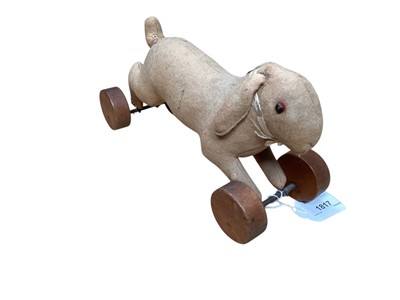 Lot 1817 - Early felt Steiff rabbit on wooden wheels. button in ear and wheels marked Steiff. Approximately 10cms long.