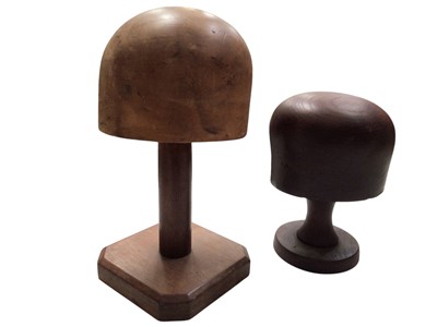 Lot 2102 - Two milliners' vintage hat blocks and four turned hat stands.