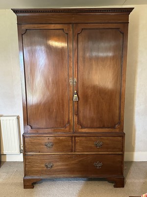 Lot 1583 - 19th mahogany wardrobe with moulded dentil cornice, twin panelled doors enclosing hanging space, above two short and one long drawer, on bracket feet, 127cm wide x 55cm deep x 204cm high