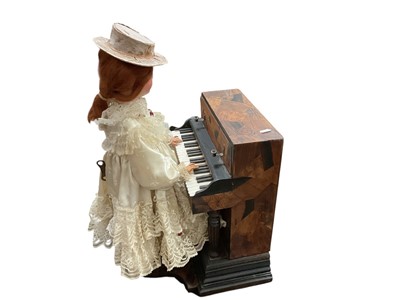 Lot 2416 - A rare antique French automaton music box, in the form of a woman playing the piano, complete with key and mechanism but not currently working.