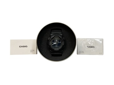 Lot 305 - Casio G-Shock with black dial on black rubber strap, in the original box with warranty card and users guide Model Number 5081
