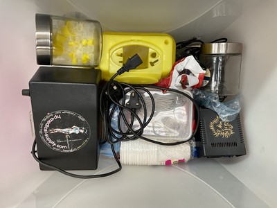 Lot 47 - Collection of tattooing equipment including machines/guns, flashes, books, etc