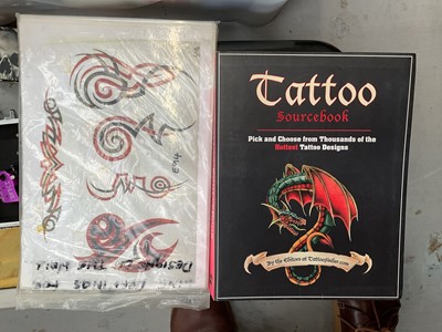 Lot 47 - Collection of tattooing equipment including machines/guns, flashes, books, etc