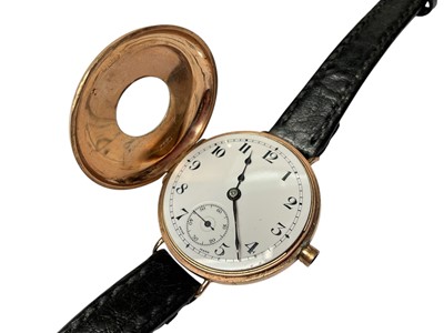 Lot 70 - 1920s 9ct gold cased half hunter wristwatch and one other 9ct gold cased Shield wristwatch, both on black leather straps