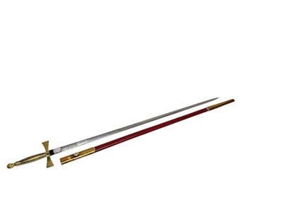 Lot 688 - Masonic sword with brass hilt and ribbed brass grip, etched steel blade by Spencer & Co, in brass mounted leather scabbard. Blade 81cm in overall length.