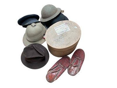 Lot 715 - 1920s/30s British Officers pith helmet, Second World War British helmet, Chauffeurs cap and sundry hats