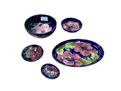 Lot 1017 - Five pieces of Moorcroft pottery on blue ground including two bowls, oval dish, smaller ditto and another bowl