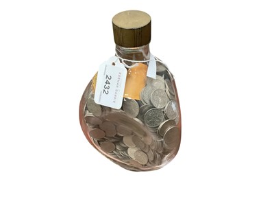Lot 2432 - Collection of mainly 1960's sixpences in a Dimple whisky bottle