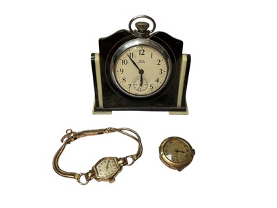 Lot 116 - 1950s 9ct gold Cyma ladies' wristwatch on 9ct gold bracelet, yellow metal watch (stamped 14K) and a Smiths Empire pocket watch mounted in a stand
