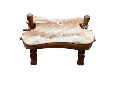Lot 2534 - Wooden seat with animal hide covering