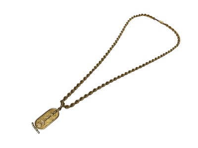 Lot 125 - Egyptian yellow metal pendant on a yellow metal ropetwist chain