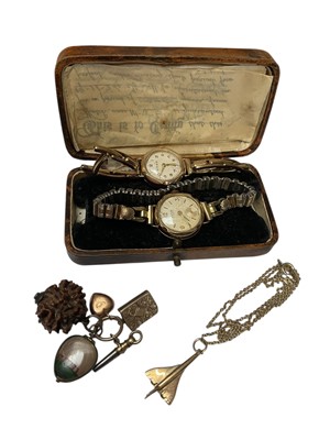 Lot 127 - Two 9ct gold cased ladies' vintage wristwatches, both on plated bracelets, together with a 9ct gold Concorde pendant, plated chain and various charms/fobs