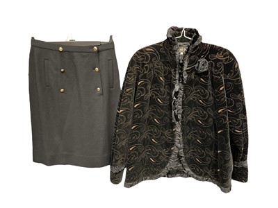 Lot 2130 - Chanel black wool skirt with 6 gold tone Chanel buttons, size 44. Fendi 365 embroidered black velvet with ribbon ruffle edging, size 46. Escada silk blouse size and one other.