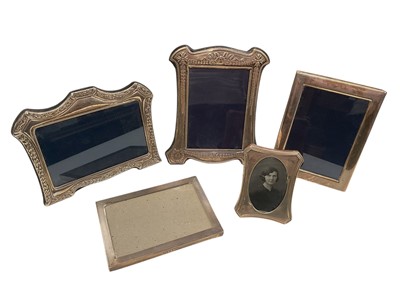 Lot 134 - Contemporary silver photograph frame of rectangular form with easel back, (Birmingham 2000), maker Carrs, together with four other silver photograph frames (various dates and makers).