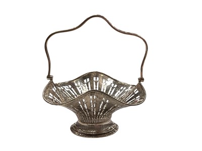 Lot 139 - George V silver bonbon dish with pierced decoration and swing handle, (Birmingham 1911), maker William Hair Haseler, 13cm in overall height, all at approximately 3.5ozs.