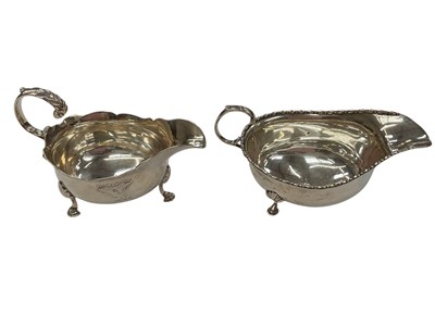 Lot 142 - George III silver sauce boat of helmet form (London 1775), together with another silver sauce boat (Birmingham 1910), all at approximately 9ozs (2).