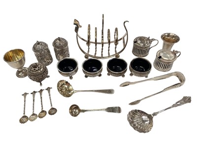 Lot 185 - Group of silver salt cellars, mustard pots and other cruets and flatware (various dates and makers), together with a silver plated toast rack, all at approximately 18ozs.