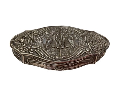 Lot 191 - Edwardian Art Nouveau silver trinket box of oval form with embossed stylised floral decoration, (Birmingham 1904), maker William Aitken, also stamped Rd. 415410, 13cm in overall length.