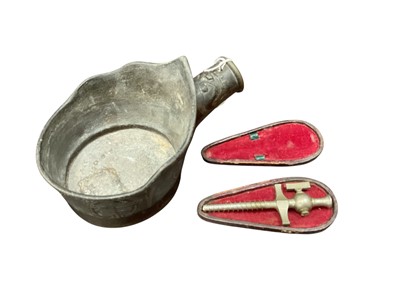 Lot 2429 - Antique Chinese bronze iron (lacking handle), together with a champagne tap in case (2).