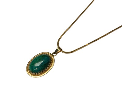 Lot 154 - Turquoise oval pendant in yellow metal mount (stamped 14K) on an Italian 14ct gold box link chain, 40cm long