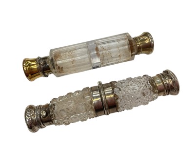 Lot 1137 - Unusual late 19th century hobnail cut glass double ended scent bottle with white metal mounts and central hinge action opening to reveal a vinaigrette, together with another double ended glass s...