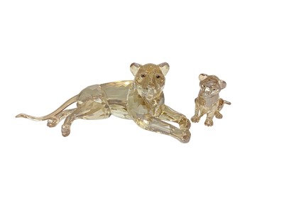 Lot 1071 - Swarovski Crystal lioness and cub, both boxed