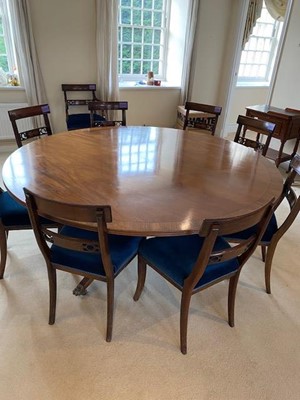 Lot 1585 - Regency style circular dining table and ten chairs