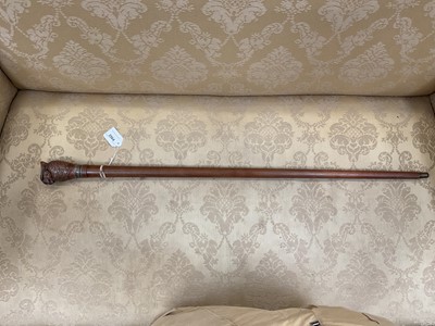 Lot 2564 - Victorian gentleman’s walking stick with wooden shaft detachable handle carved and painted and stained in the form of a parrot’s head, with glass eyes and a white metal collar, unscrewing to rev...