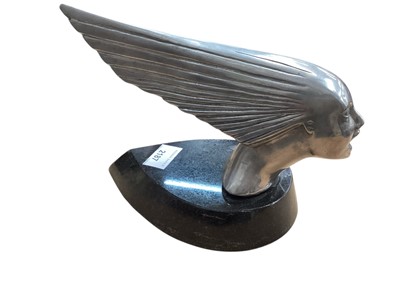 Lot 2187 - Art Deco style metal car mascot in the form of a stylised woman's head, 25cm in overall length