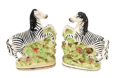 Lot 284 - Pair of Staffordshire pottery models of zebra, circa 1850