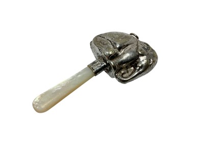 Lot 1163 - Late 19th/early 20th century white metal child's rattle in the form of an elephant with mother of pearl teether
