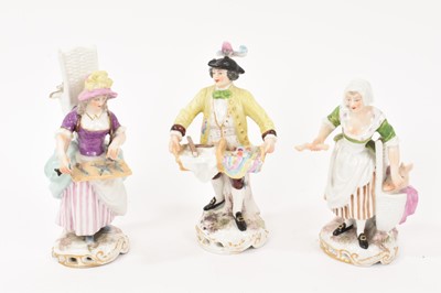 Lot 299 - Set of three Continental porcelain figures of street vendors, circa 1900