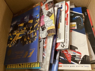 Lot 2190 - Collection of motorsport programmes to include Formula One (F1), American racing and some framed prints.