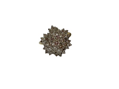 Lot 251 - Diamond flower shape cluster ring with thirty-seven brilliant cut diamonds in a claw setting on 18ct gold shank (London 1982). Ring si...