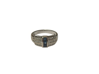 Lot 255 - Art Deco style sapphire and diamond ring with three vertical square step cut blue sapphires flanked by three rows of brilliant cut dia...