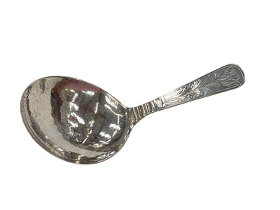 Lot 271 - Early 18th century continental silver caddy spoon, possibly Dutch, with engraved floral decoration, engraved to reverse of bowl 'Ecs Mld 1707', 11.7cm in length.