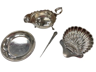 Lot 274 - Victorian silver sauce boat, together with a shell butter dish and another silver dish, (various dates and makers), all at approximately 8.5ozs