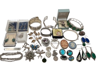Lot 281 - Group of silver and white metal jewellery including bangles, two Scottish brooches, other brooches, locket pendant on chain, semi-precious gem stone jewellery etc