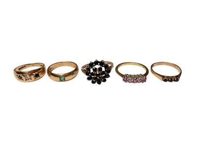 Lot 296 - Five 9ct gold and gem-set dress rings to include a sapphire and diamond gypsy ring, emerald gypsy ring, a sapphire cluster ring and two others