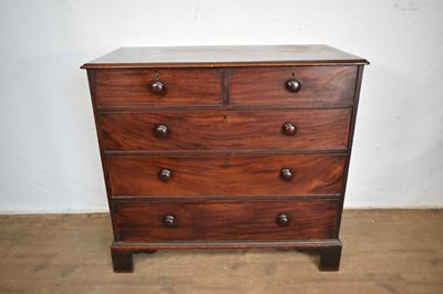 Lot 1552 - Georgian mahogany chest of two short and three long drawers with bun handles on bun feet