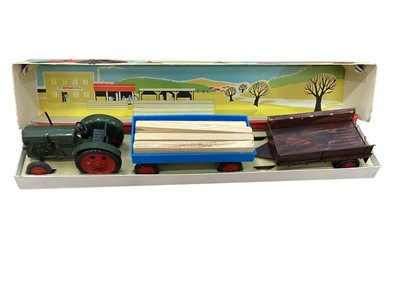 Lot 1822 - GBZ made in GDR plastic tractor and trailers (1)