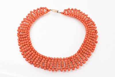 Lot 677 - Victorian coral bead fringe necklace with a wide collar-style band of coral beads on a gold metal clasp, 34cm