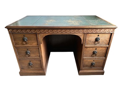 Lot 1259 - Late 19th century mahogany twin pedestal desk, the green leather lined top above an arrangement of six drawers with brass lion mask ring handles