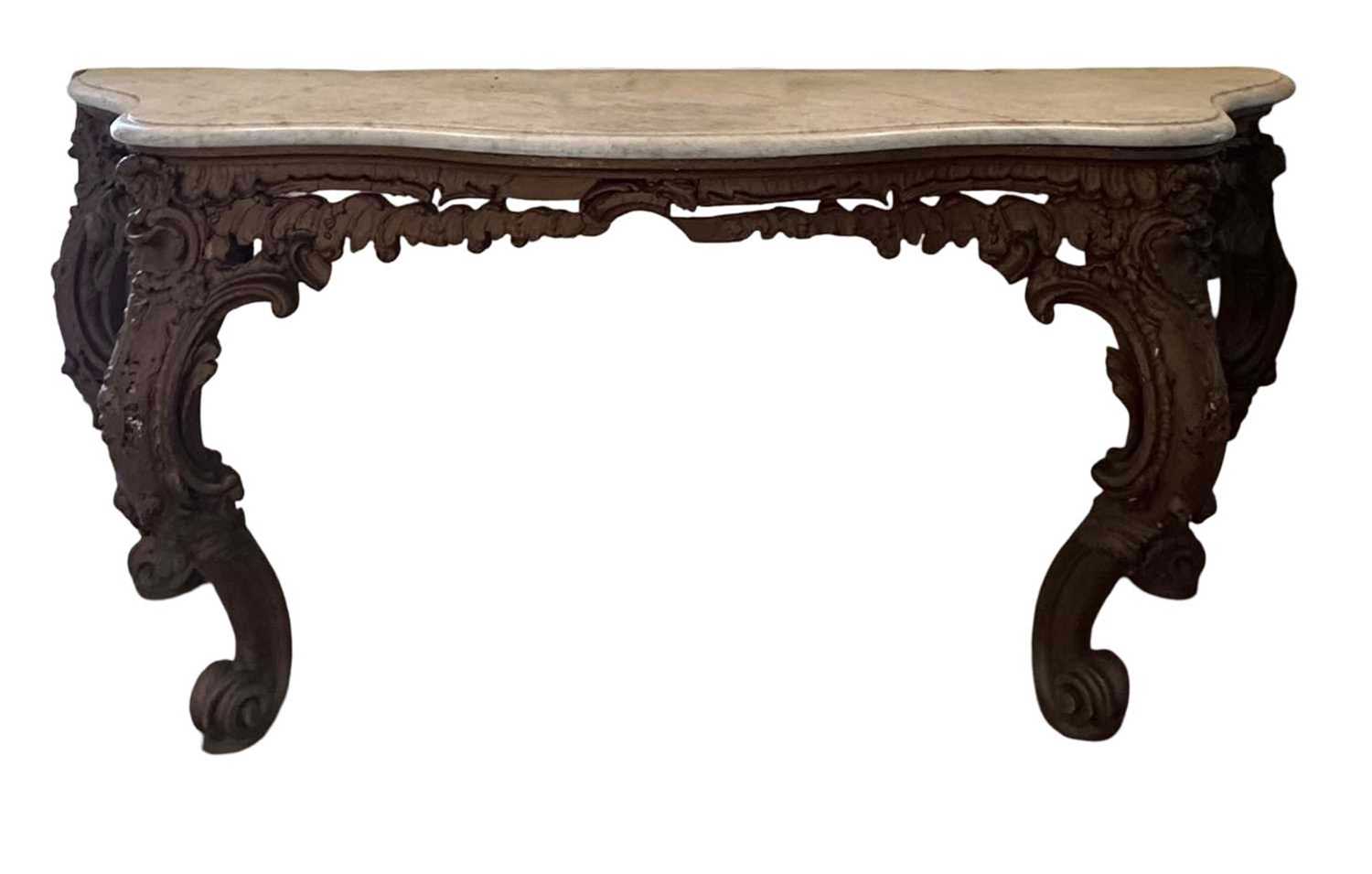 Lot 1260 - 19th century gilt painted and carved console table on four scroll cabriole legs with floral crestings and a serpentine marble top