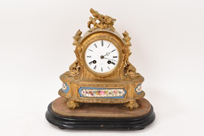 Lot 5111 - 19th century French gilt brass mantel clock with inset porcelain panels